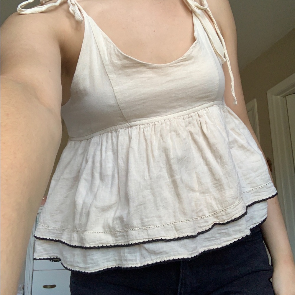 Cream and black peplum tank